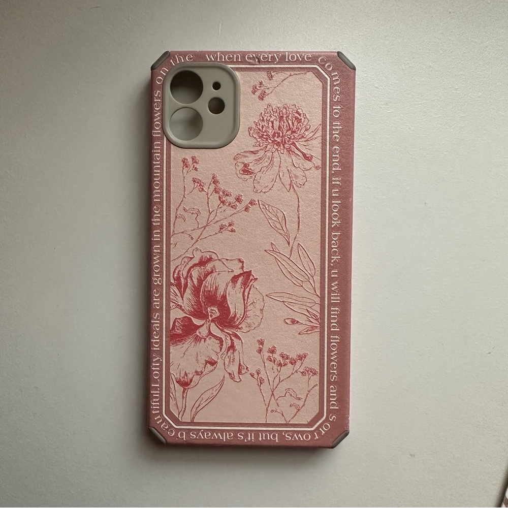 iPhone 11 phone case. pink flower print with writing design.